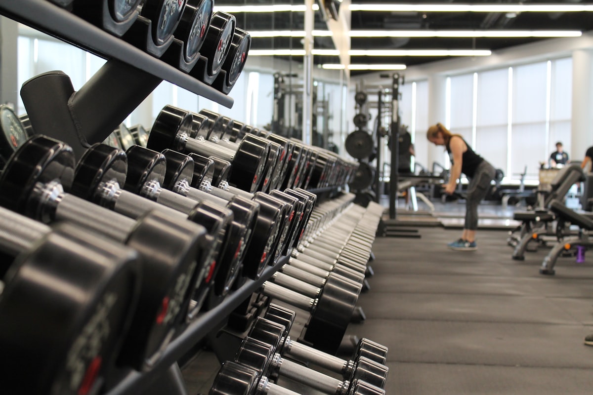 Racked dumbbells on the floor of a fitness studio